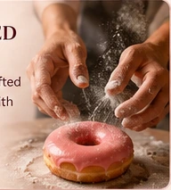 A baker handcrafting a donut